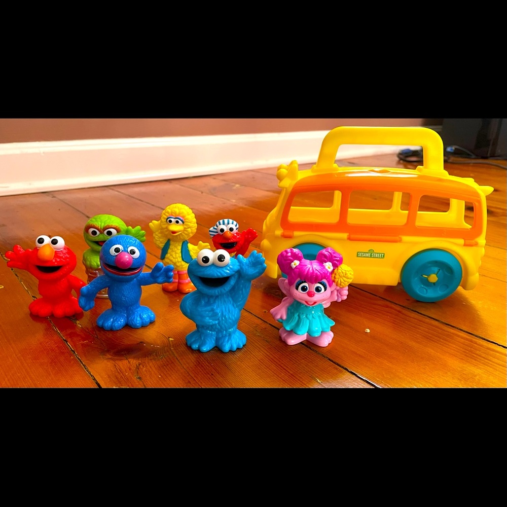 Sesame Street figures and bus